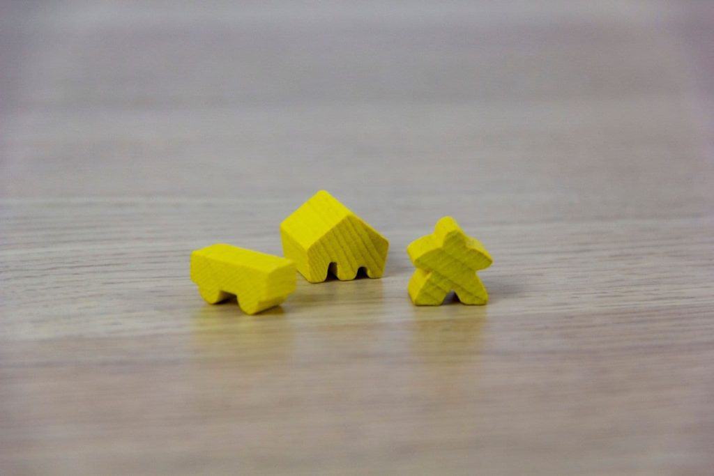 meeple pieces from a cooperative board game