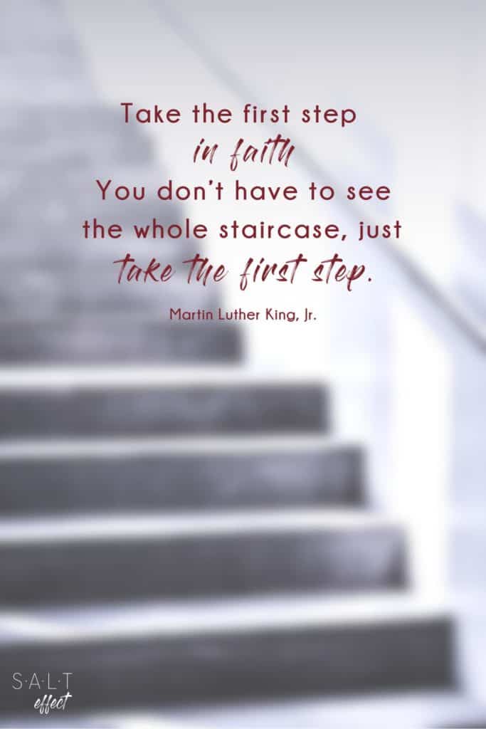 This is a new beginnings quotes pin: "Take the first step in faith. You don't have to see the whole staircase, just take the first step." Quote by Martin Luther King, Jr. in burgundy against a black and white background of a blurred staircase.