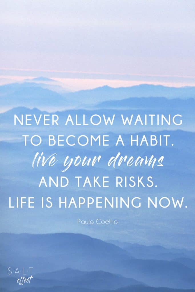 "Never allow waiting to become a habit. Live your dreams and take risks. Life is happening now." New beginnings quote by Paulo Coelho is white on a background of blue mountains.