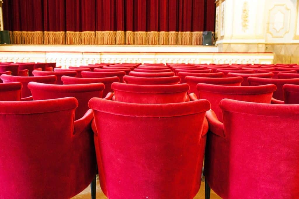 seats in a theater and part of the stage