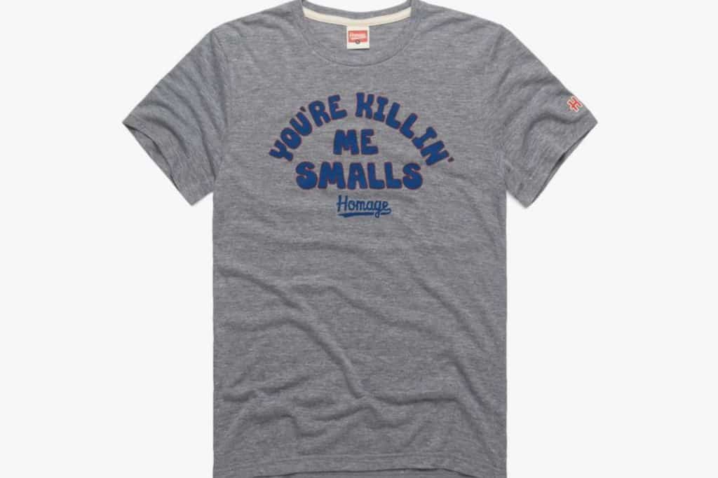 Homage tshirt for tween and teen boys that says "You're killin' me smalls" in blue bubble letters on a gray background