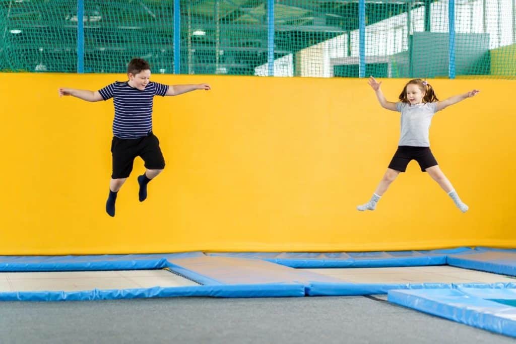 kids jumping at a trampoline park
