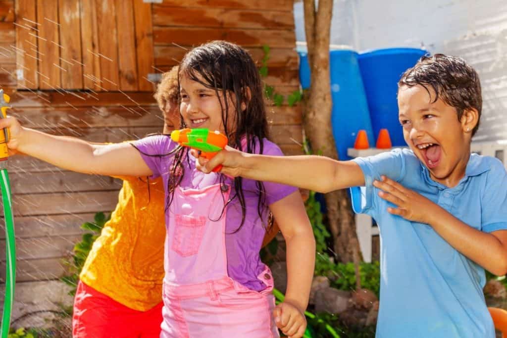 kids having a water gun fight