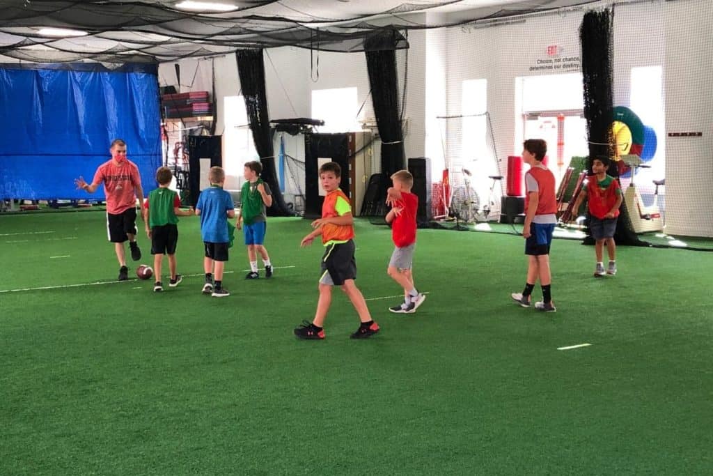 boys playing flag football indoors