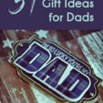 Pinterest pin that says "51 Practical Gift Ideas for Dads" in light blue against a dark blue background. Image of blue plaid gift tag that says "I'm so lucky you're my dad" and www.salteffect.com at the bottom