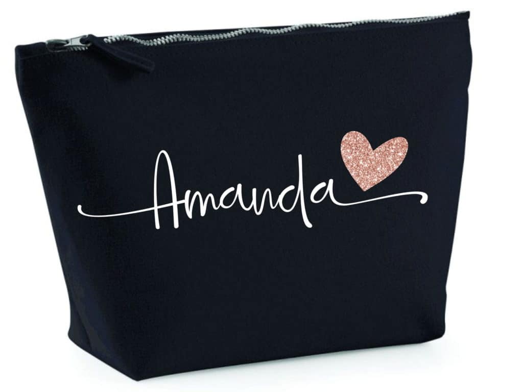 Black personalized makeup bag for 8th grade graduation gift. Amanda is written on the front in white font with a pink glitter heart