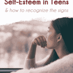 Pinterest pin that says "5 causes of low self-esteem in teens & how to recognize the signs." Title is in burgundy and dark pink at top of image over white torn paper. Large image is of girl who looks sad and lonely staring out a window, SALT effect logo at the bottom