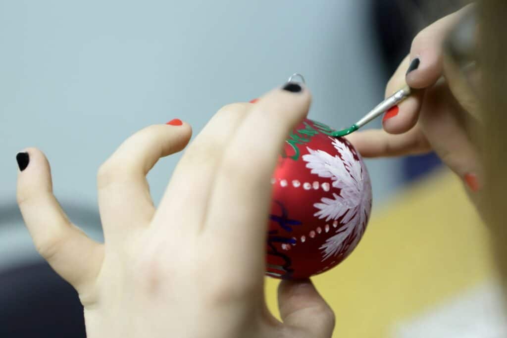 painting a holiday ornament